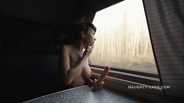 Naked fellow traveler with a dildo.