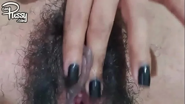 Extreme close-up hairy pussy masturbation